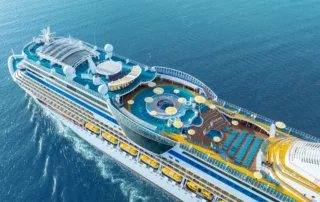 Cruise ships sailing across blue ocean symbolising a safe and ready cruise ship course with fully trained personal of STCW