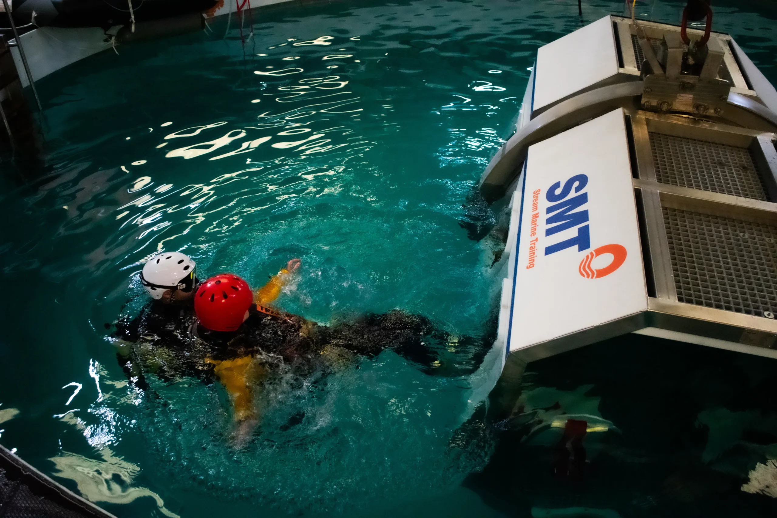 Stream Marine Training HUET Instructor Diver supporting delegate from the HUET in the pool