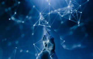 Robotic hand reaching toward glowing digital network lines, symbolising the future of AI, simulation and technology in offshore training.