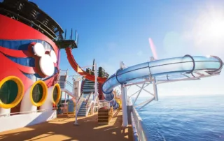 Disney Cruise Line ship deck with waterslide and ocean view, representing cruise ship careers and life working onboard