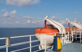 Lifeboat and deck equipment on a commercial vessel illustrating STCW proficiency in security awareness for seafarers